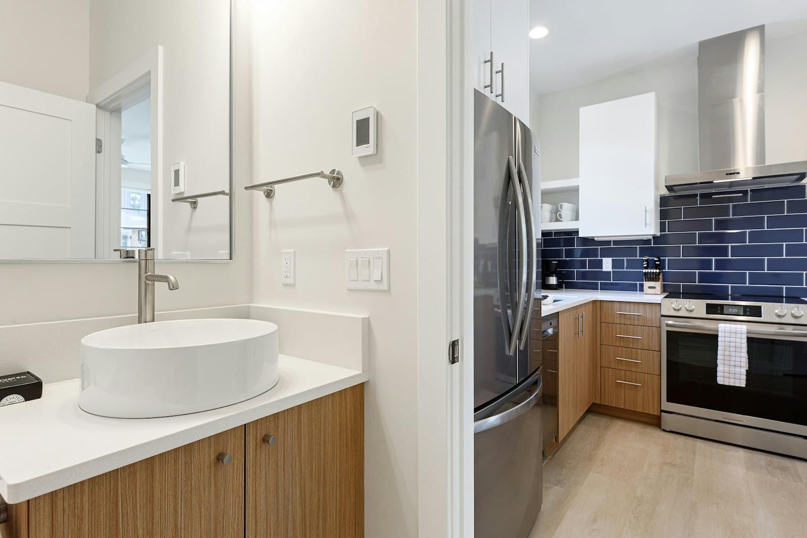 Bathroom vessel sink looking through to the kitchen