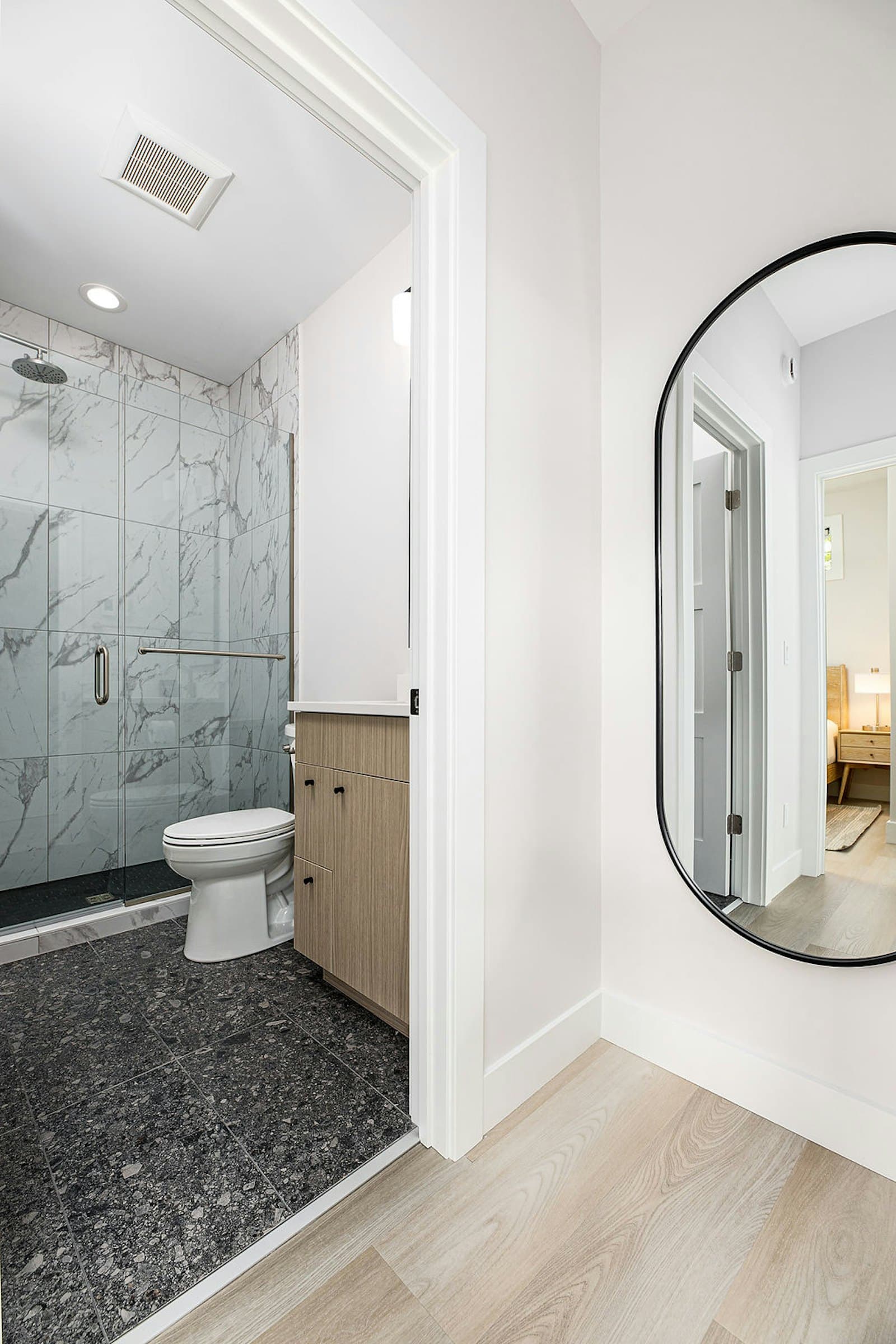 Hallway view into the shower and bathroom