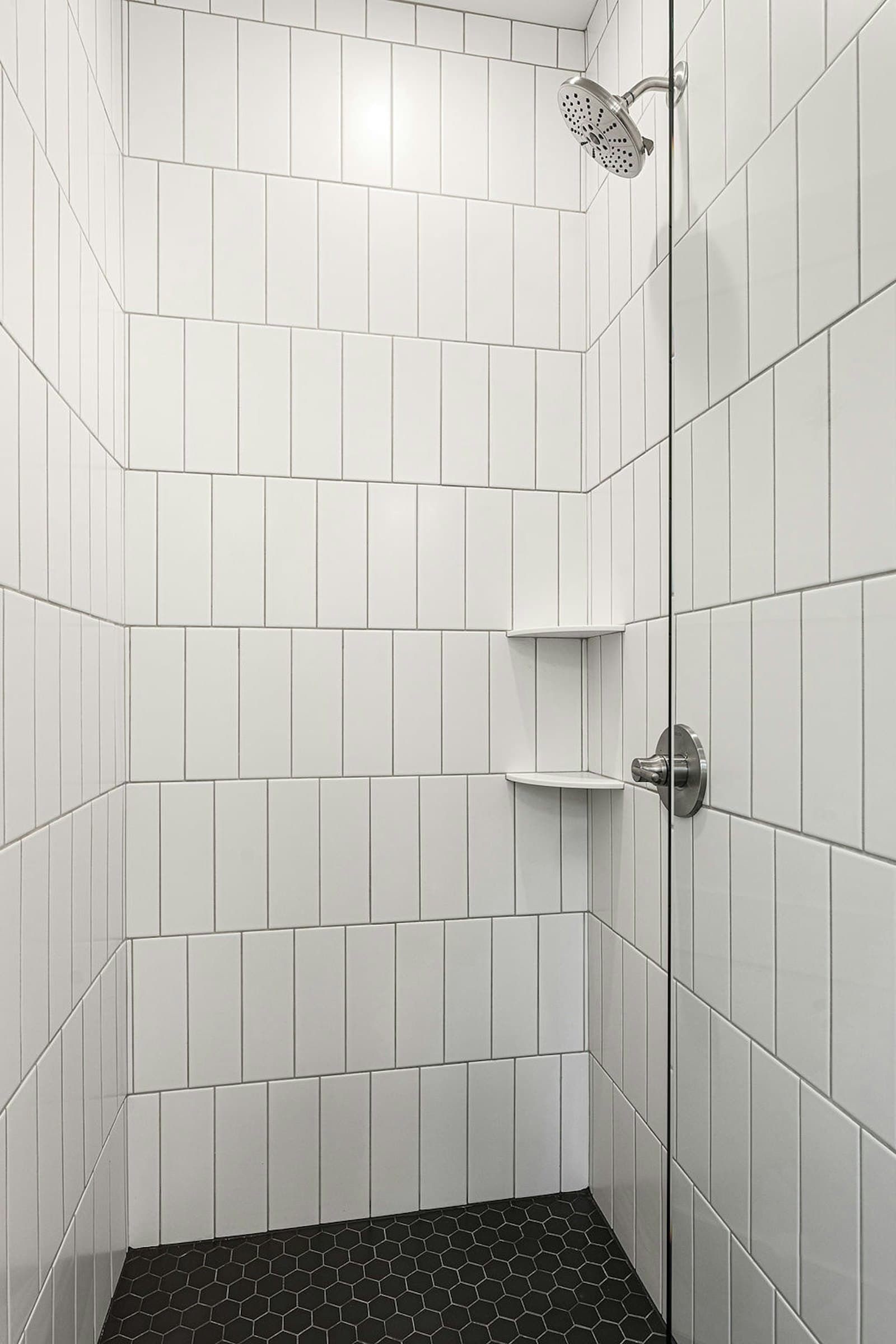 Walk-in shower with vertical subway tile