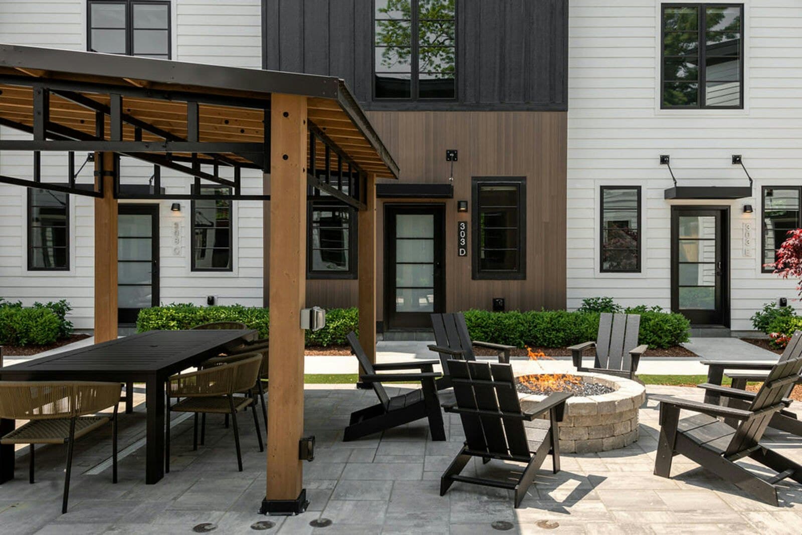 Courtyard pergola dining and circular fire pit