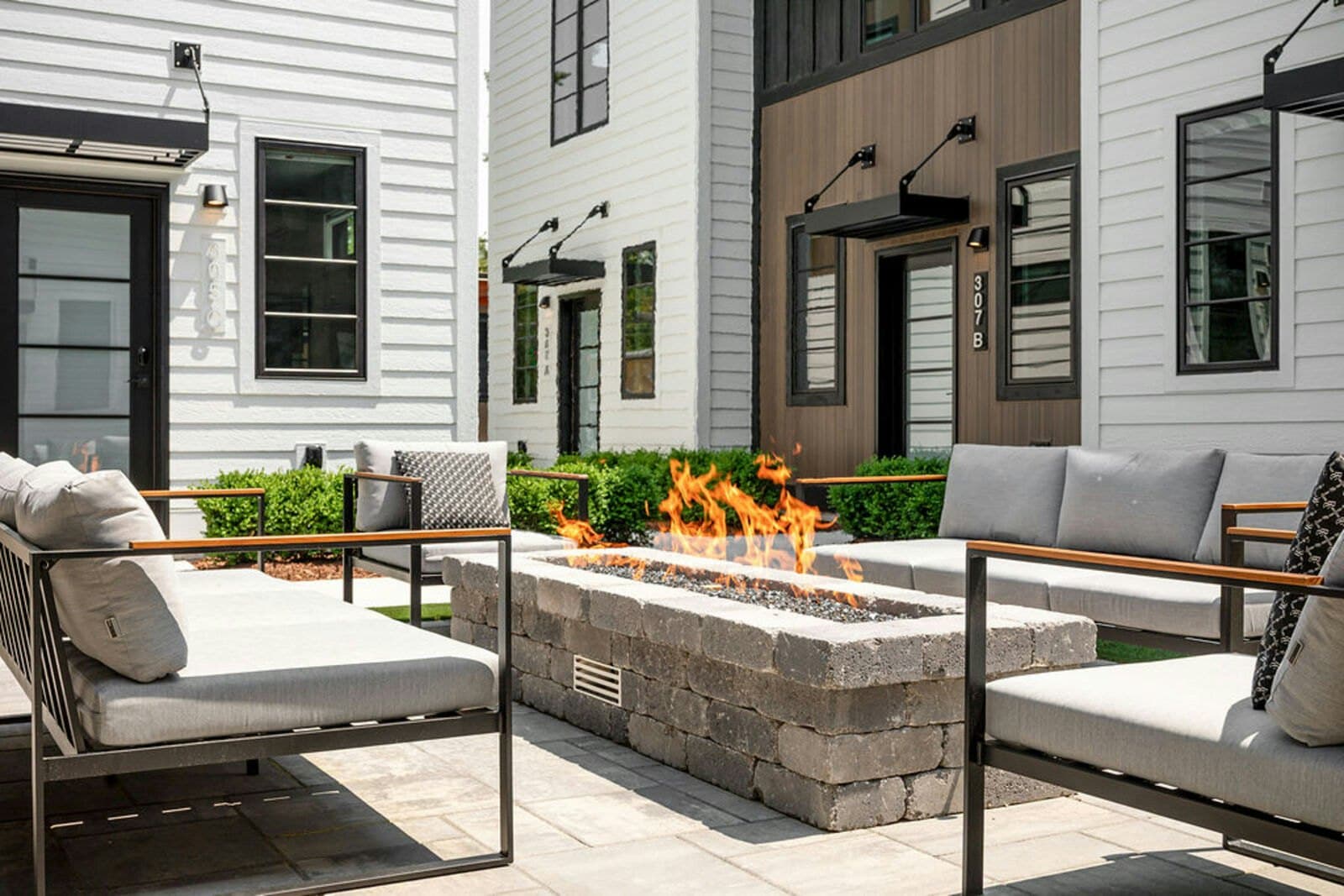Lounge chairs around the courtyard fire pit, units 307 A and 307 B