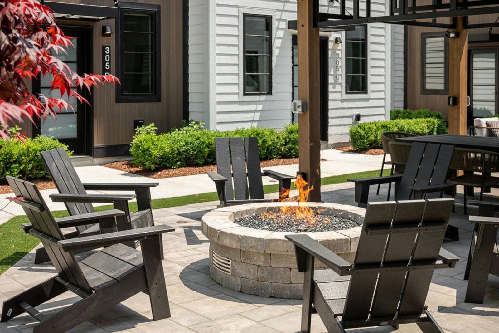 Fire pit with units 305 B and 305 C beyond