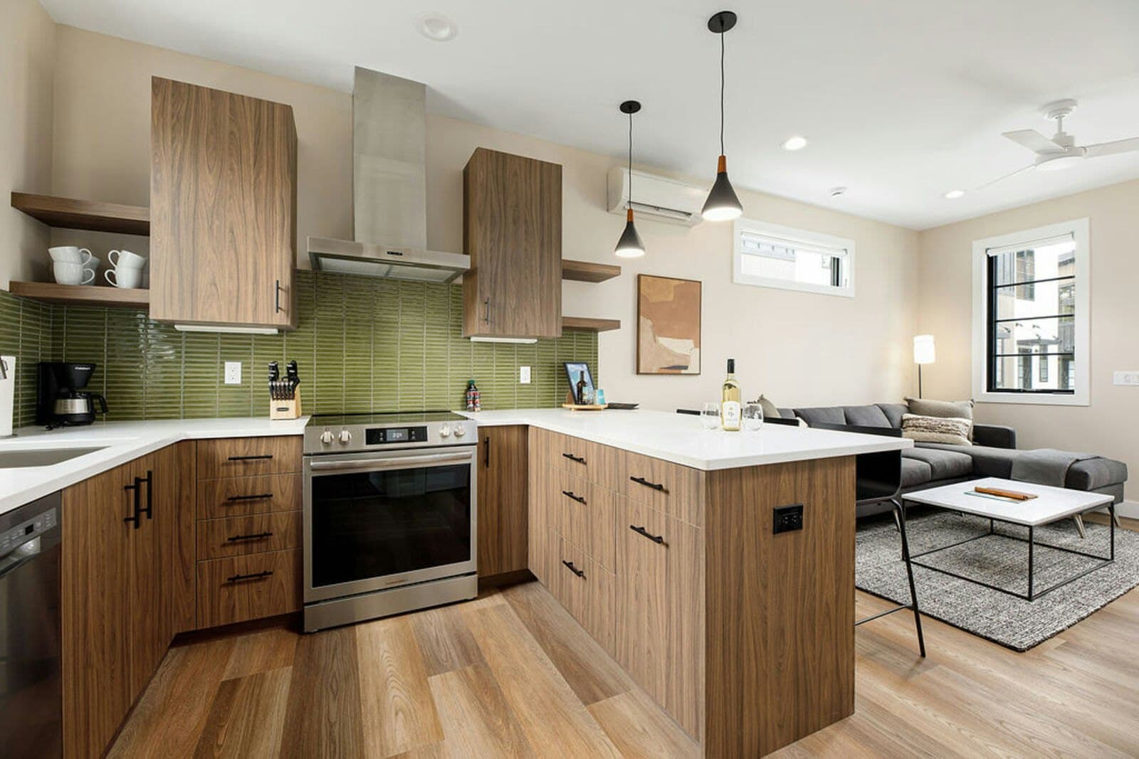 Kitchen with wood cabinets and green tile backsplash