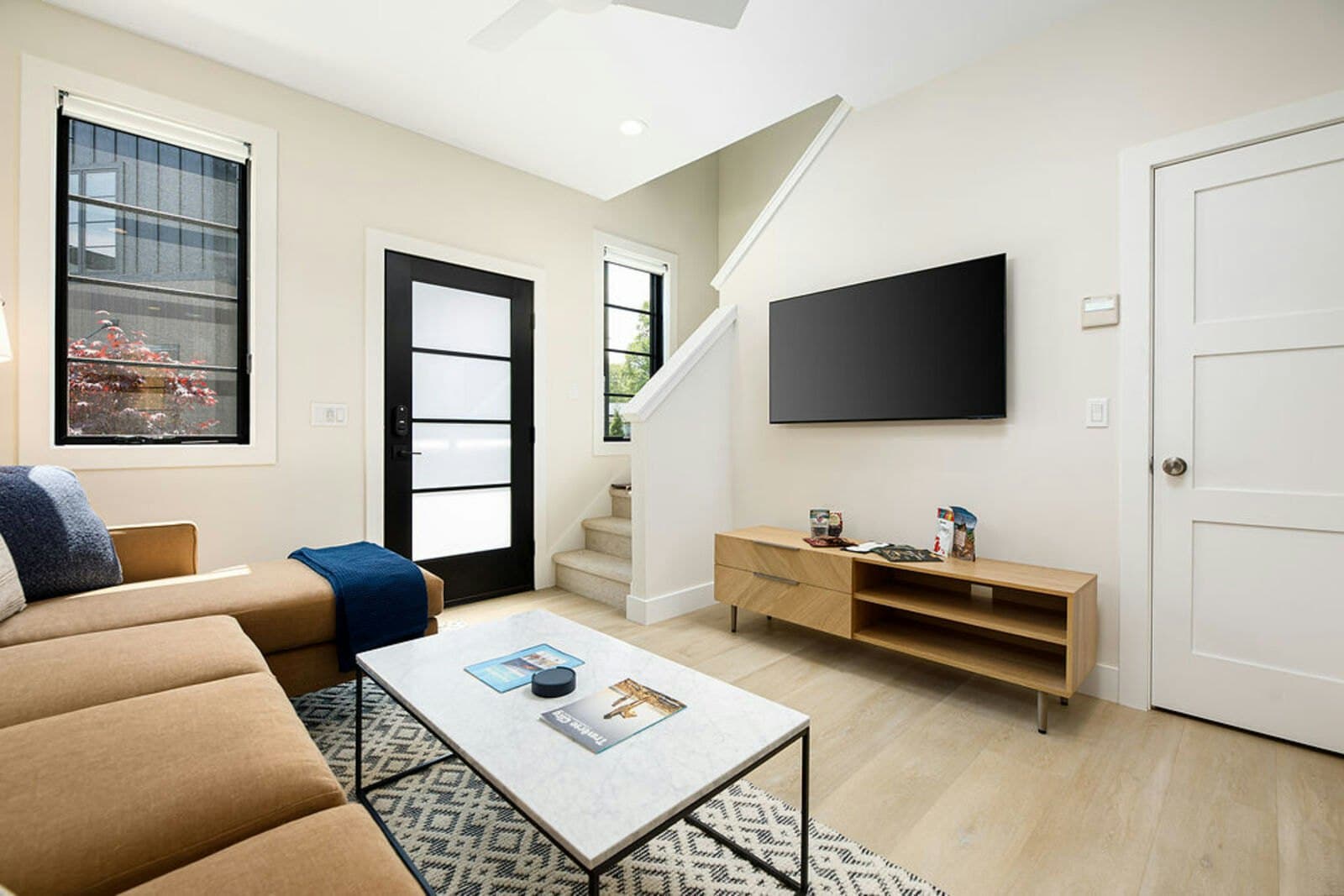 Open living area with sofa and media console