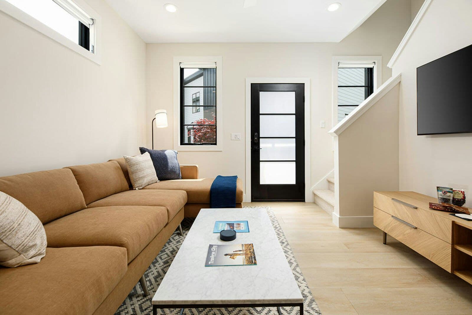 Mustard sectional living room with courtyard door