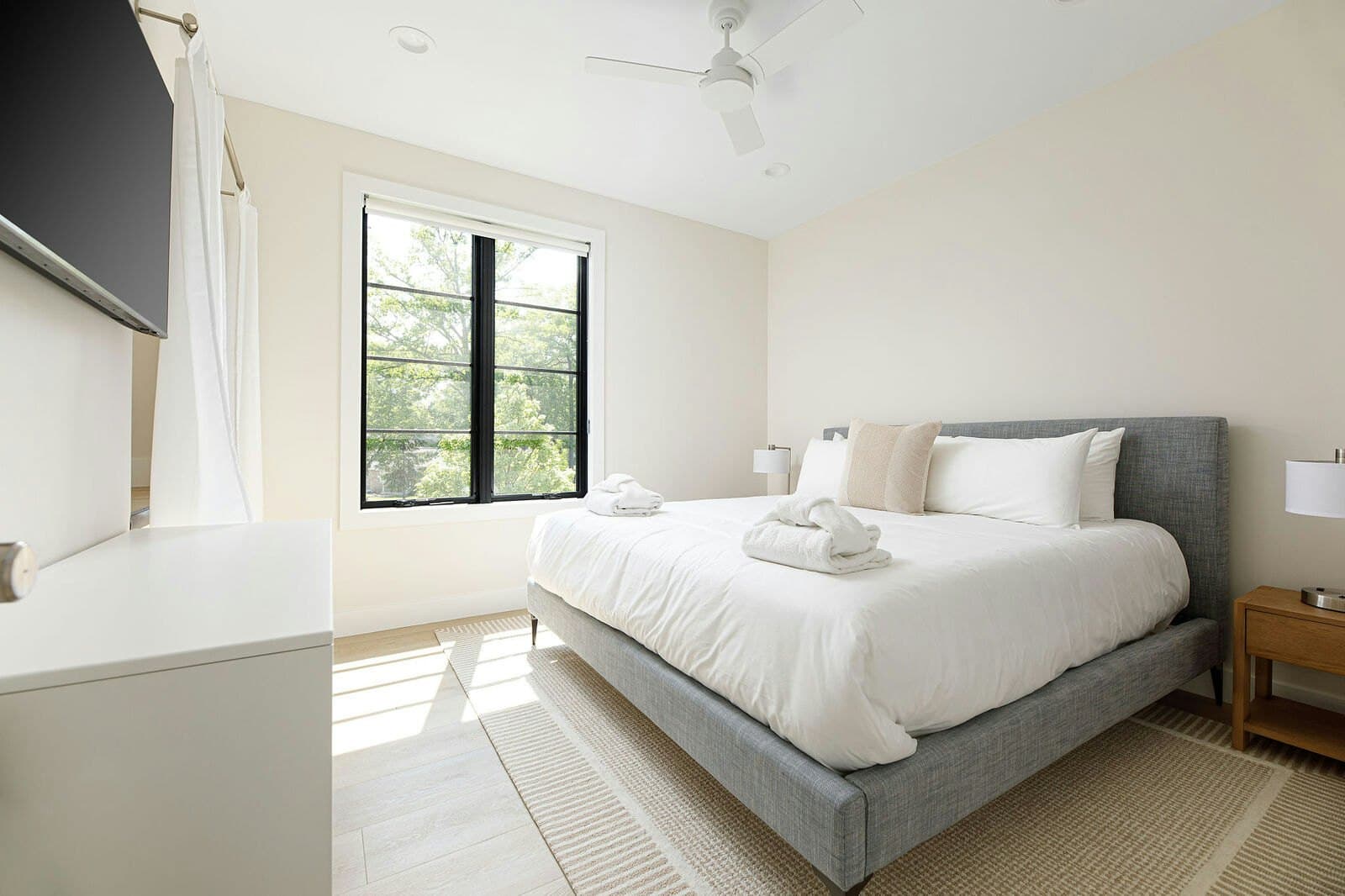 Bedroom with robes folded on the bed
