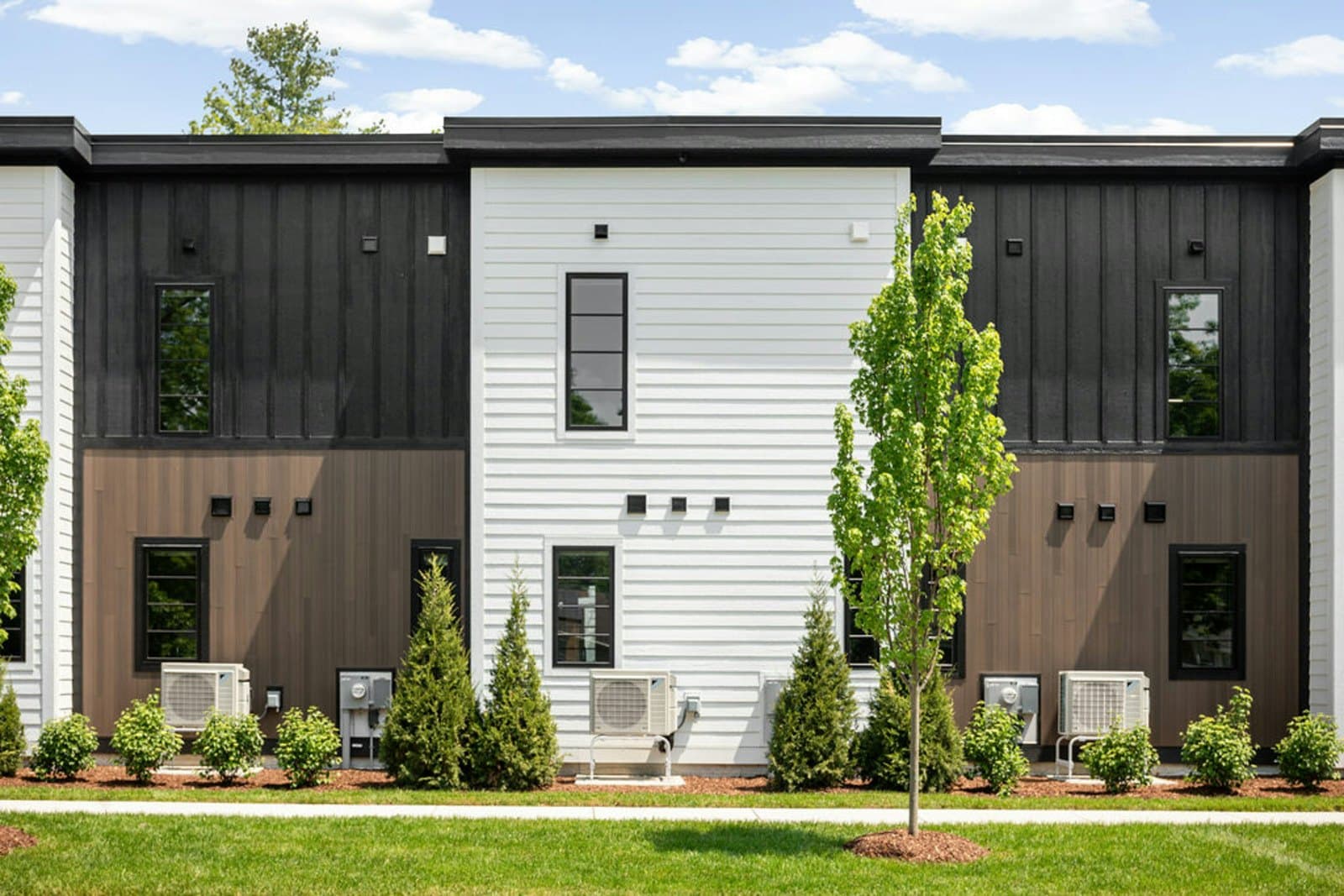 Townhome exteriors, lawn, and landscaping